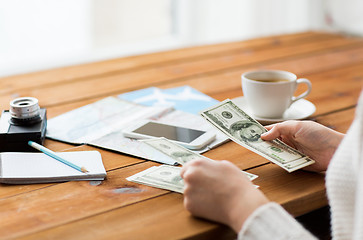 Image showing close up of traveler hands counting dollar money