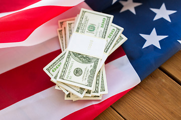 Image showing close up of american flag and dollar cash money