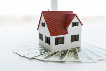 Image showing close up of home or house model and money