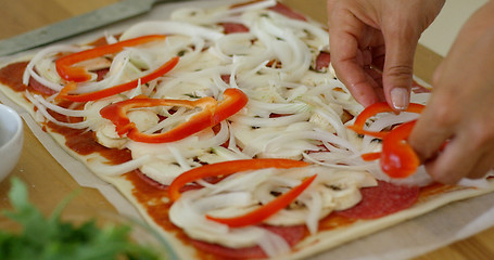 Image showing Woman make a tasty traditional homemade pizza