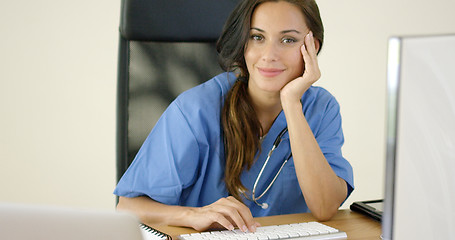 Image showing Serious female doctor at laptop computer