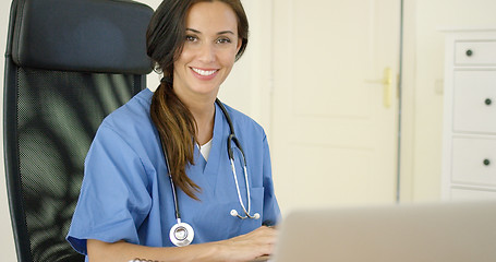 Image showing Beautiful female doctor at laptop computer