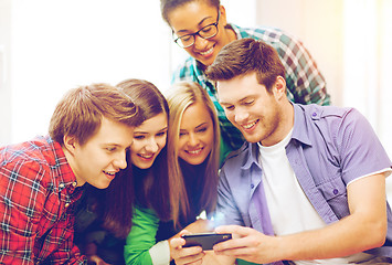 Image showing students looking at smartphone at school