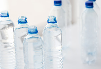 Image showing close up of bottles with drinking water on table