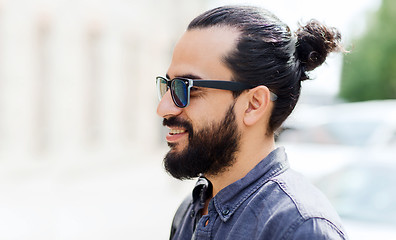 Image showing happy smiling man with beard on city street