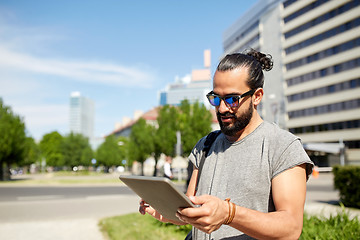 Image showing man traveling with backpack and tablet pc in city