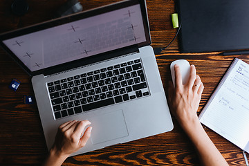 Image showing Female designer working on computer