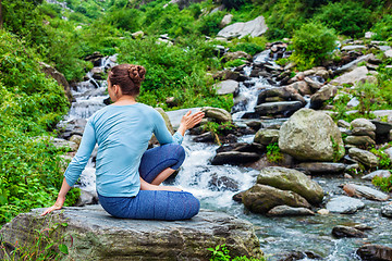 Image showing Woman doing Ashtanga Vinyasa Yoga asana Marichyasana D