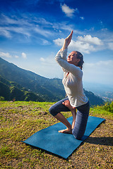 Image showing Woman doing Ashtanga Vinyasa yoga advanced asana