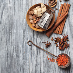 Image showing Various spices on wood