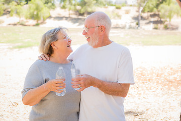 Image showing Happy Healthy Senior Couple with Water Bottles