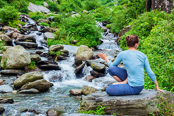 Image showing Woman doing Ashtanga Vinyasa Yoga asana Marichyasana D