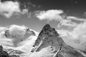 Image showing Black and white winter mountains in clouds