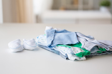 Image showing close up of baby boys clothes for newborn on table