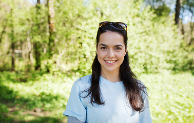 Image showing happy young volunteer woman outdoors