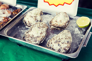 Image showing oysters or seafood on ice at asian street market