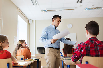 Image showing group of students and teacher with test results