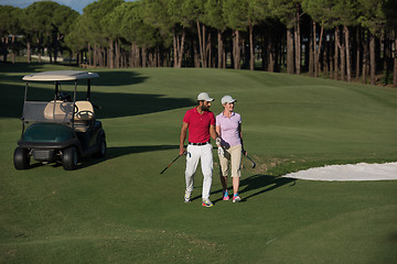 Image showing couple walking on golf course