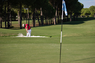 Image showing golfer hitting a sand bunker shot