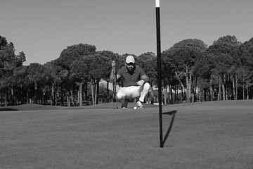 Image showing golf player aiming perfect  shot