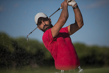 Image showing golfer hitting a sand bunker shot