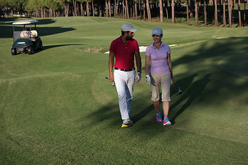 Image showing couple walking on golf course