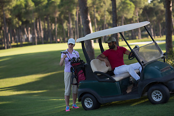 Image showing couple in buggy on golf course