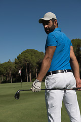Image showing golf player portrait from back