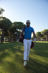 Image showing golf player walking