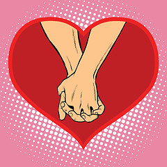 Image showing Male and female hand together in a red heart symbol of love