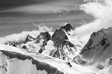 Image showing Black and white winter mountains with snow cornice