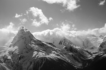 Image showing Black and white winter mountains with clouds