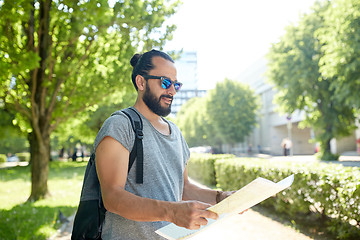 Image showing man traveling with backpack and map in city