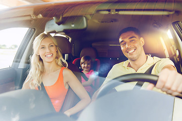 Image showing happy family with little child driving in car