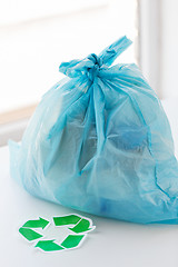 Image showing close up of rubbish bag with green recycle symbol