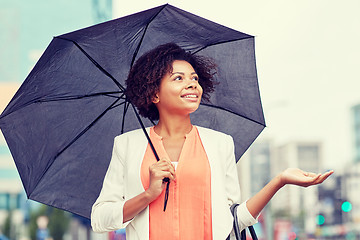 Image showing happy african american businesswoman with umbrella