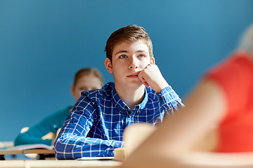 Image showing group of students with notebooks at school lesson