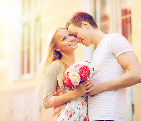 Image showing couple with flowers in the city