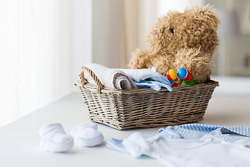 Image showing close up of baby clothes and toys for newborn