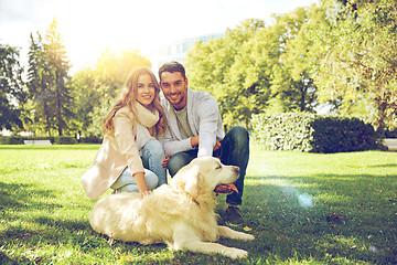 Image showing happy couple with labrador dog walking in city