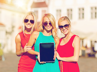 Image showing beautiful tourist girls holding tablet pc