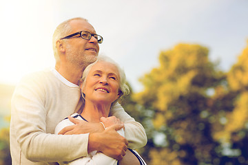 Image showing senior couple hugging in park