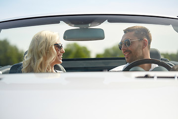 Image showing happy man and woman driving in cabriolet car