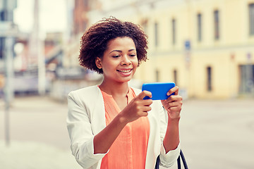 Image showing happy african businesswoman with smartphone