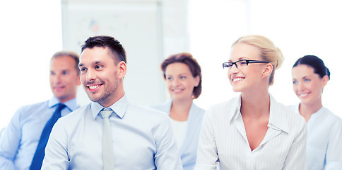 Image showing businessmen and businesswomen on conference