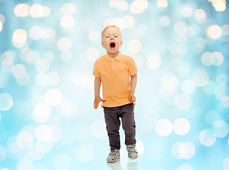 Image showing happy little boy shouting or sneezing