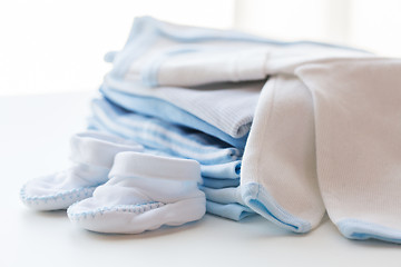 Image showing close up of baby boys clothes for newborn on table