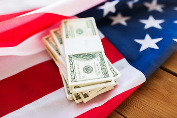 Image showing close up of american flag and dollar cash money