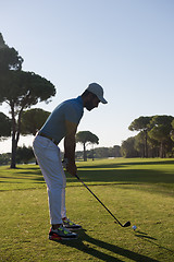 Image showing golf player hitting shot