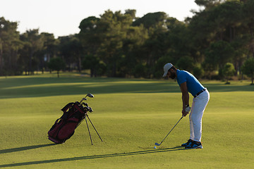 Image showing golfer hitting long shot